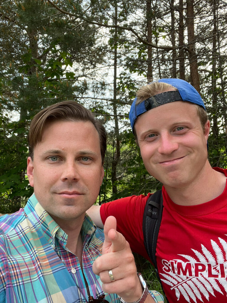 O.W. Root and Brendan Donley grinning, O.W. pointing at camera.