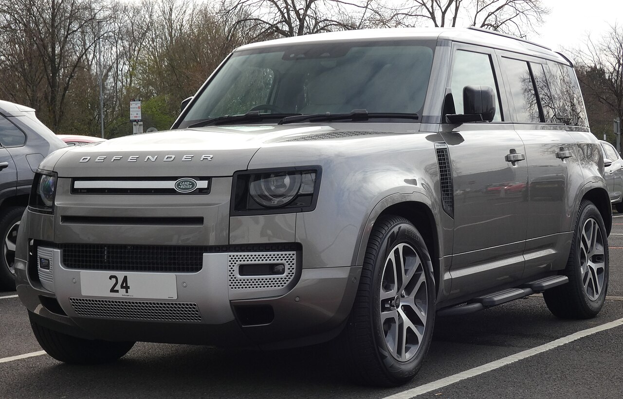 Grey land rover defender with “24” on front bumper.