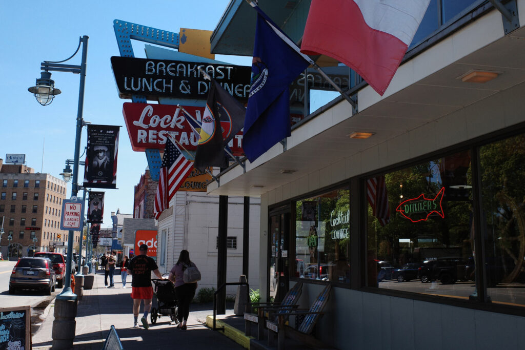 View of downtown Sault Ste. Marie with vintage 50s style sign for “breakfast lunch and dinner” at Lock Restaurant.