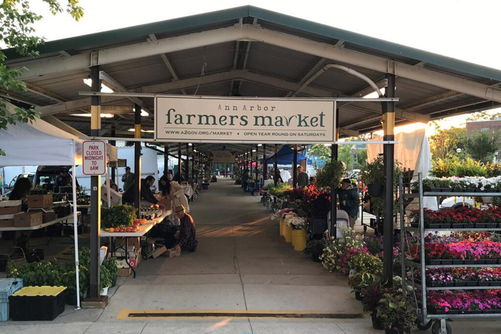 Ann Arbor farmer’s market with sign reading “Ann Arbor Farmer’s Market”.
