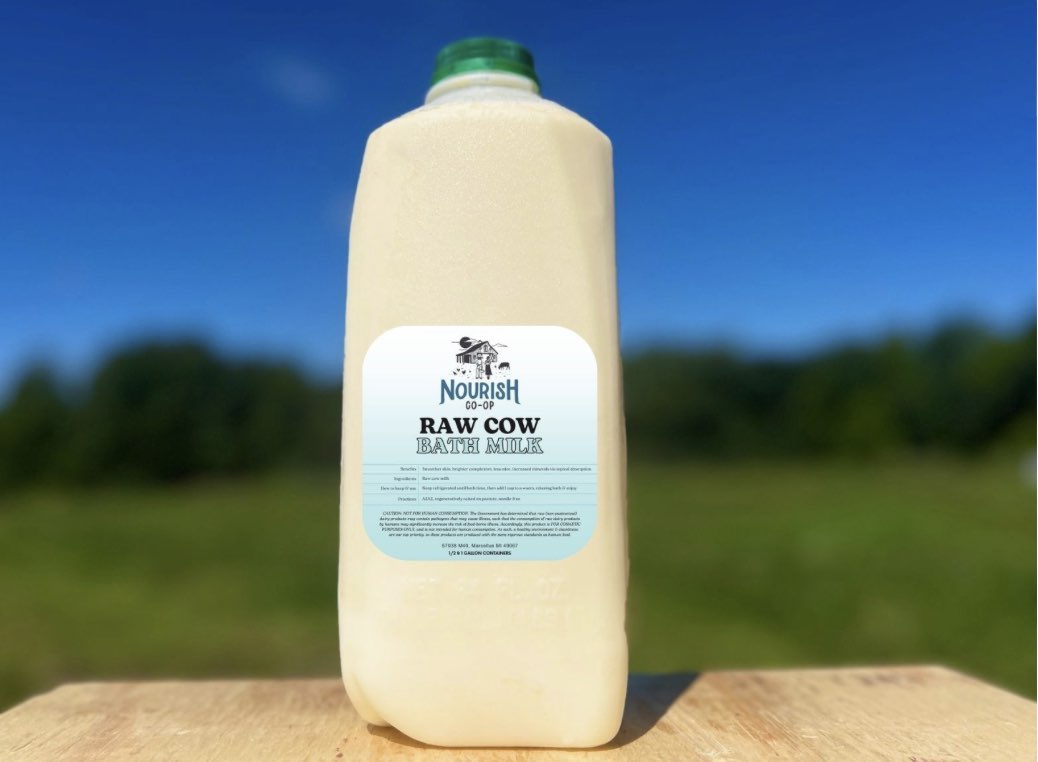 A carton of “nourish co-op raw cow bath milk.”