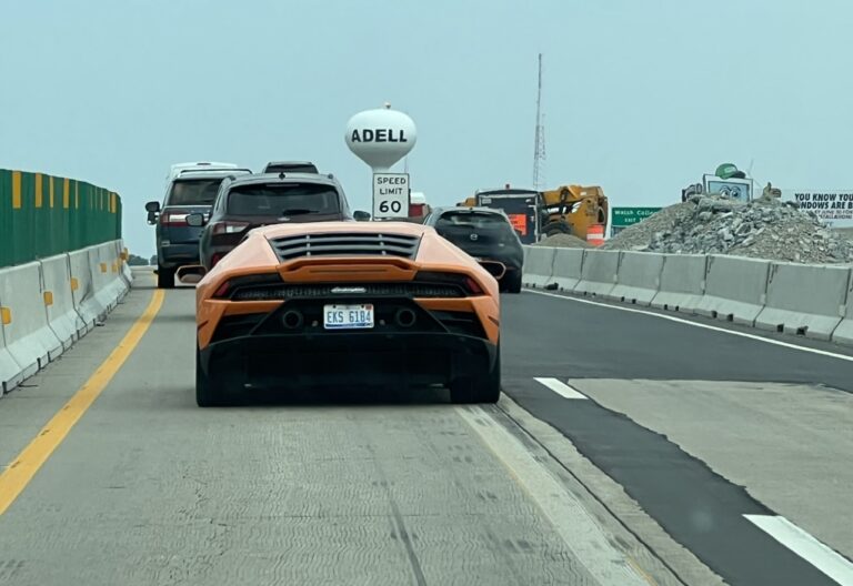 Orange Lamborghini on highway.