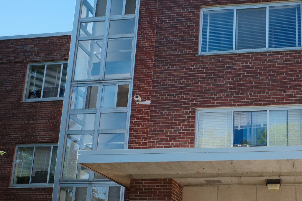 Surveillance camera on exterior of dormitory on MSU campus.