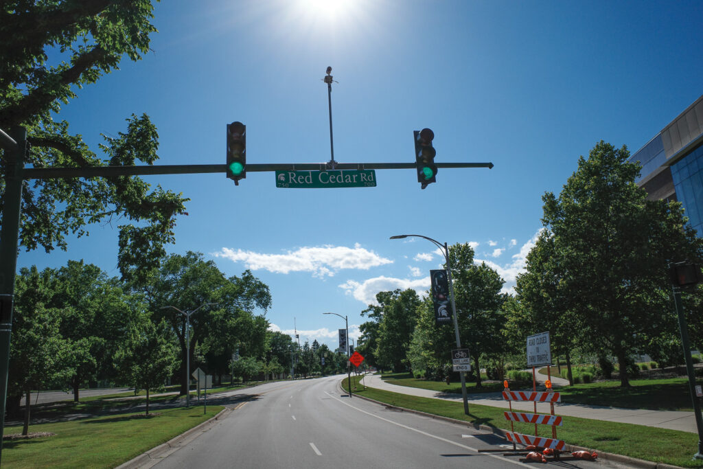 Surveillance camera above traffic light on Red Cedar Rd on MSU campus.