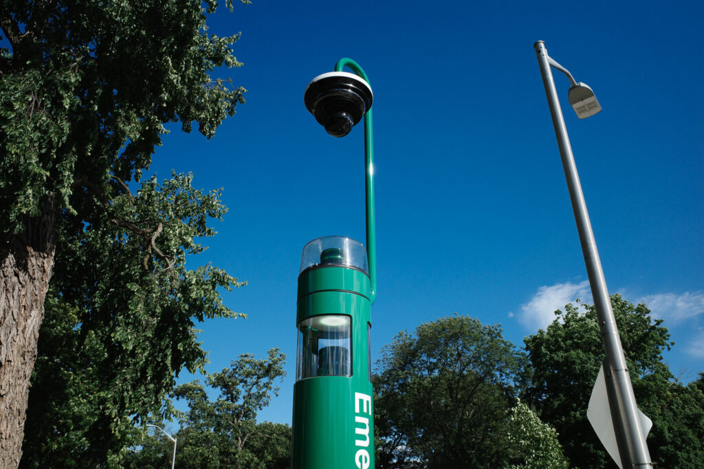 Camera above emergency green light telephone on MSU campus.