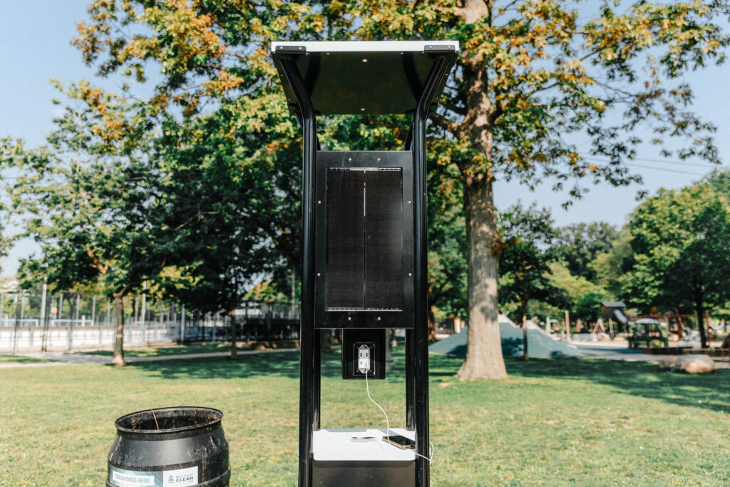 Charging station with plug in public park.