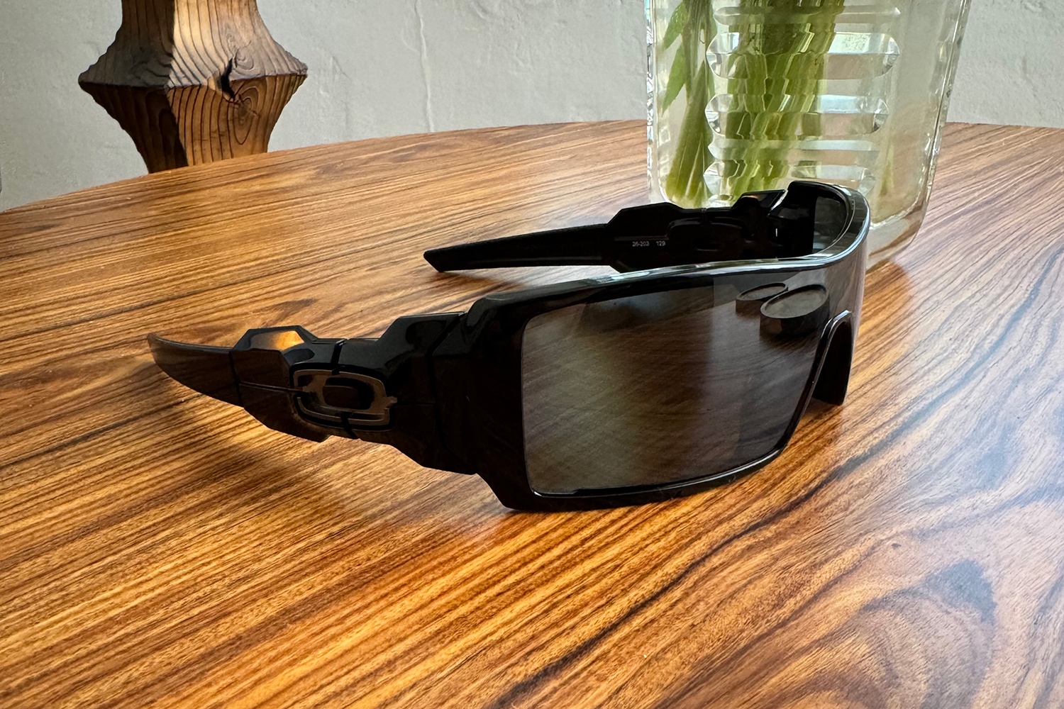 Oakley Oil Rig sunglasses on wooden table.