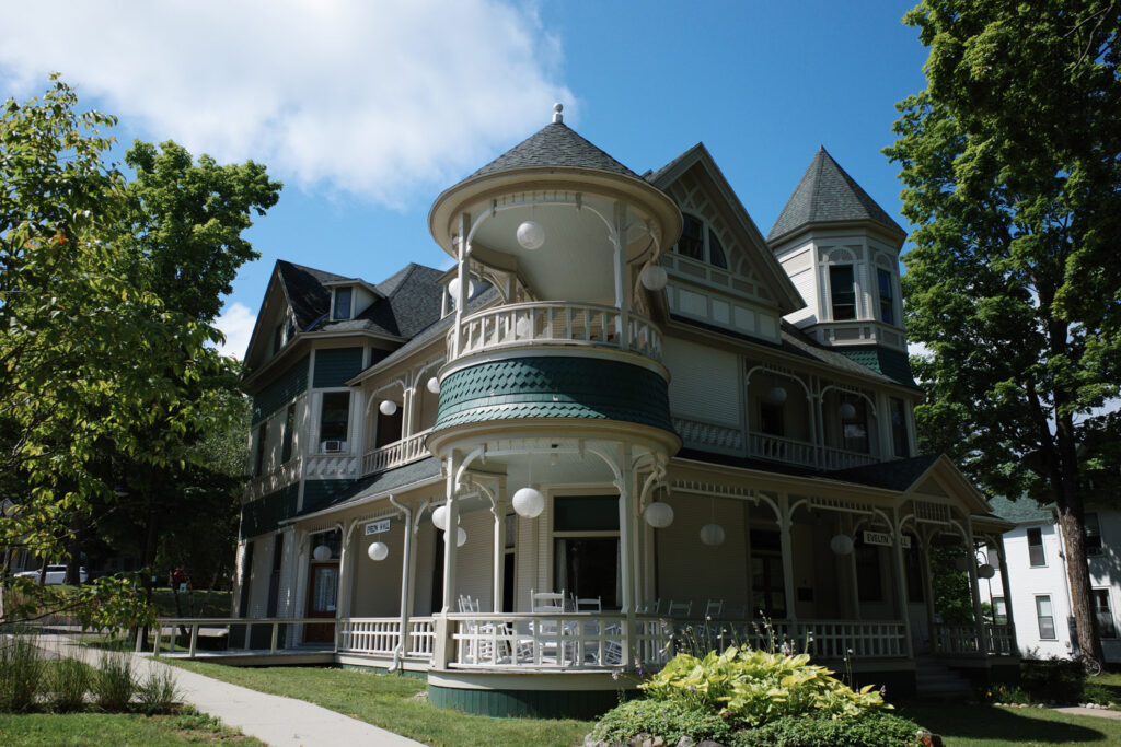 Old home with turrets and paper lanterns handing off balconies.