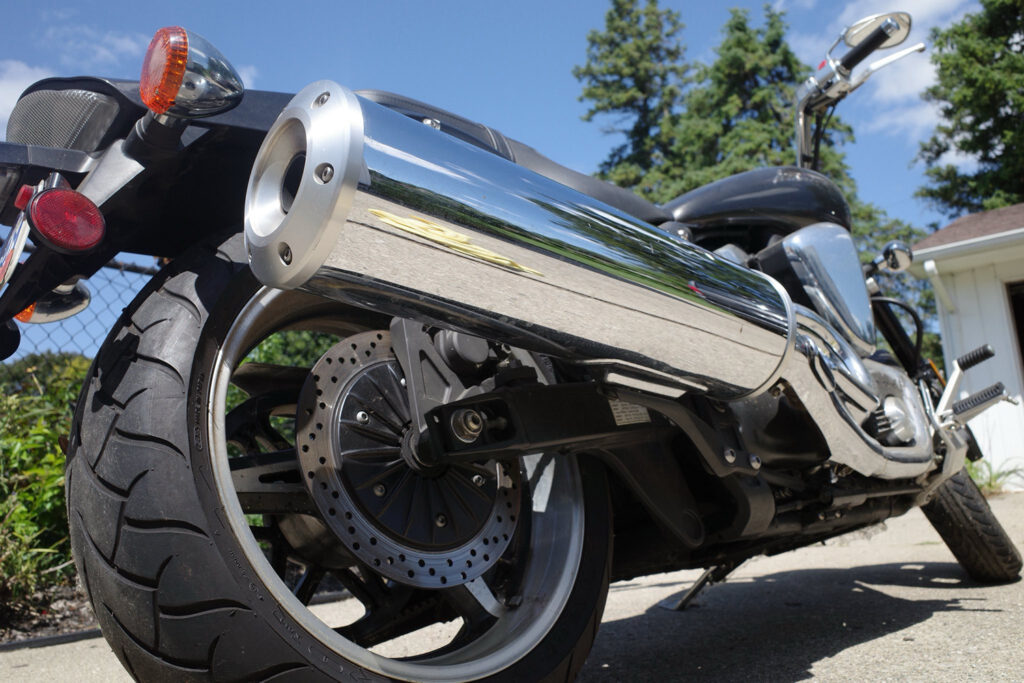 Close up of motorcycle in driveway.