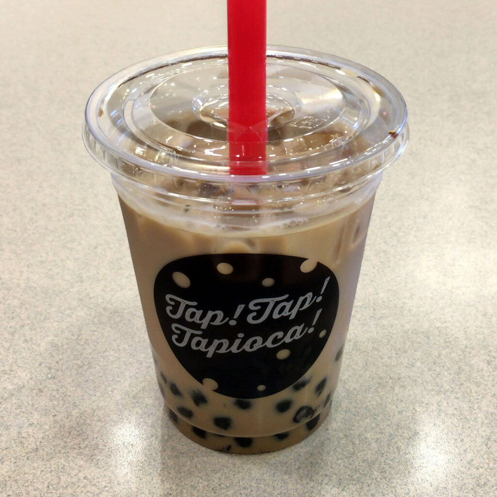 Bubble Tea with tapioca pearls and cup reading "Tap! Tap! Tapioca!"