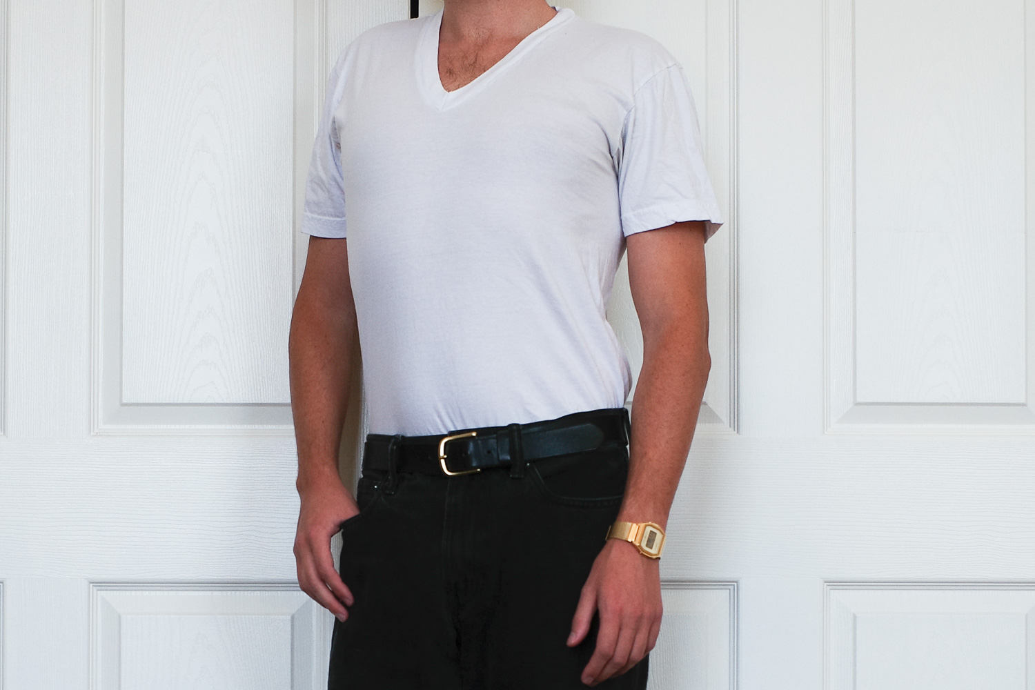 Man in white v-neck t-shirt.