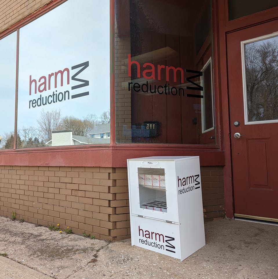 Entrance to MI Harm Reduction, with naloxone box outside.