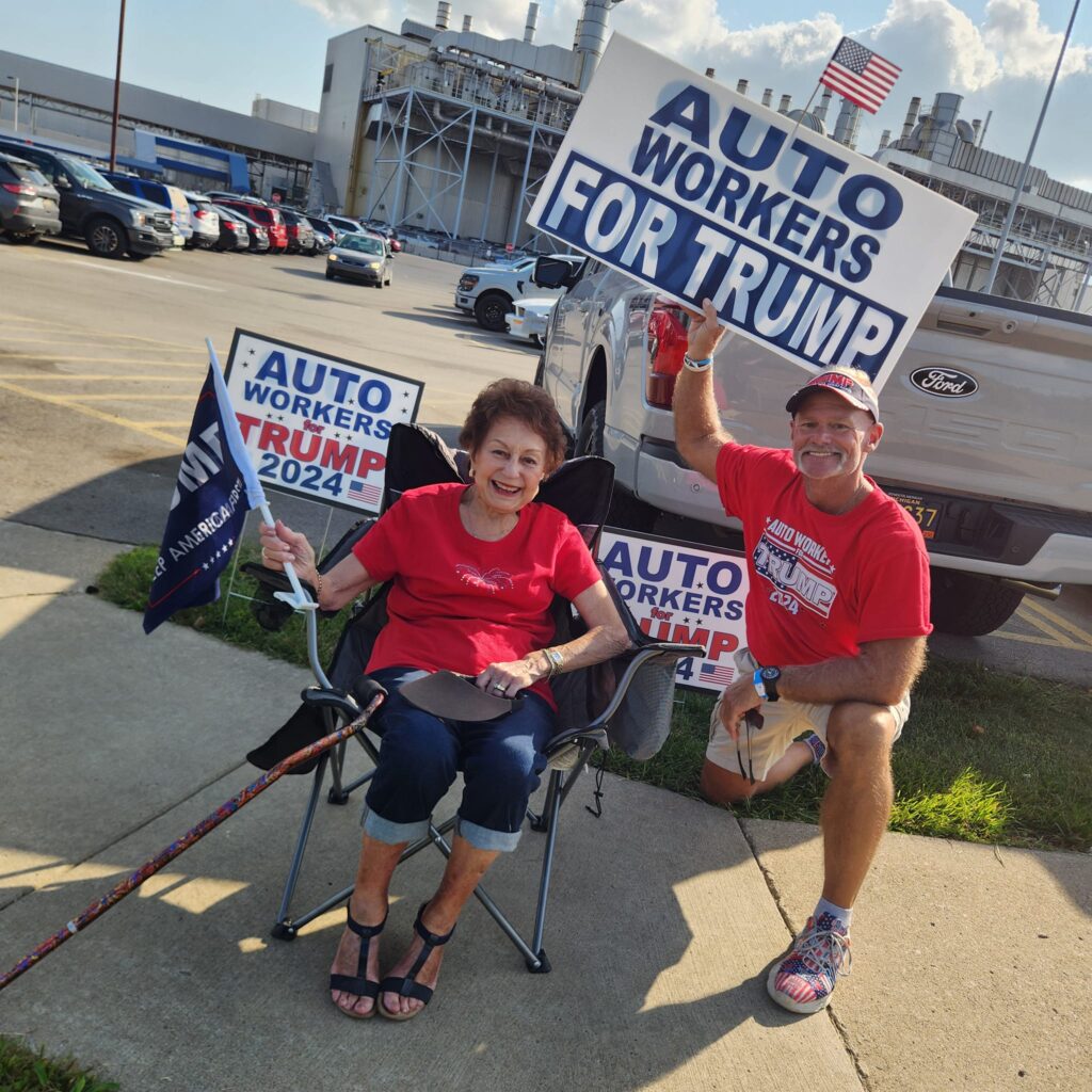 Auto Workers for Trump with signs outside rally.