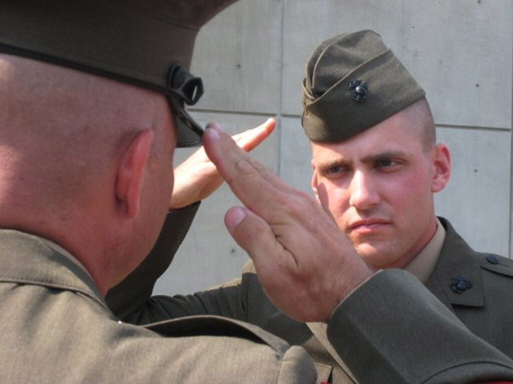 Fink as a Marine lieutenant saluting.