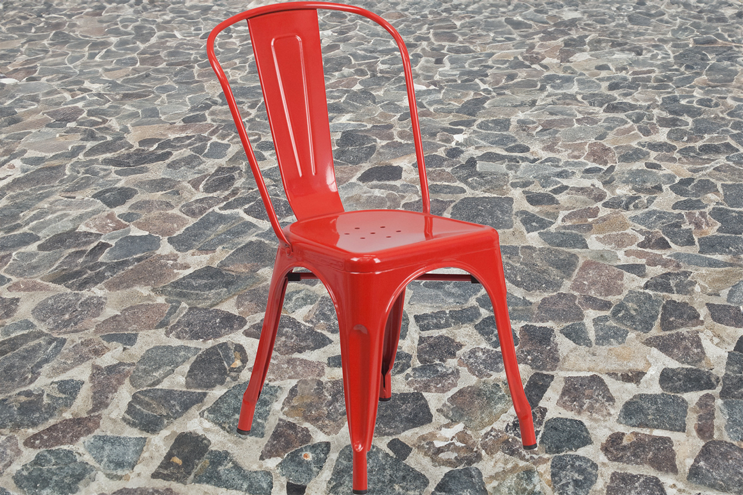 Red metal stacking bistro chair.