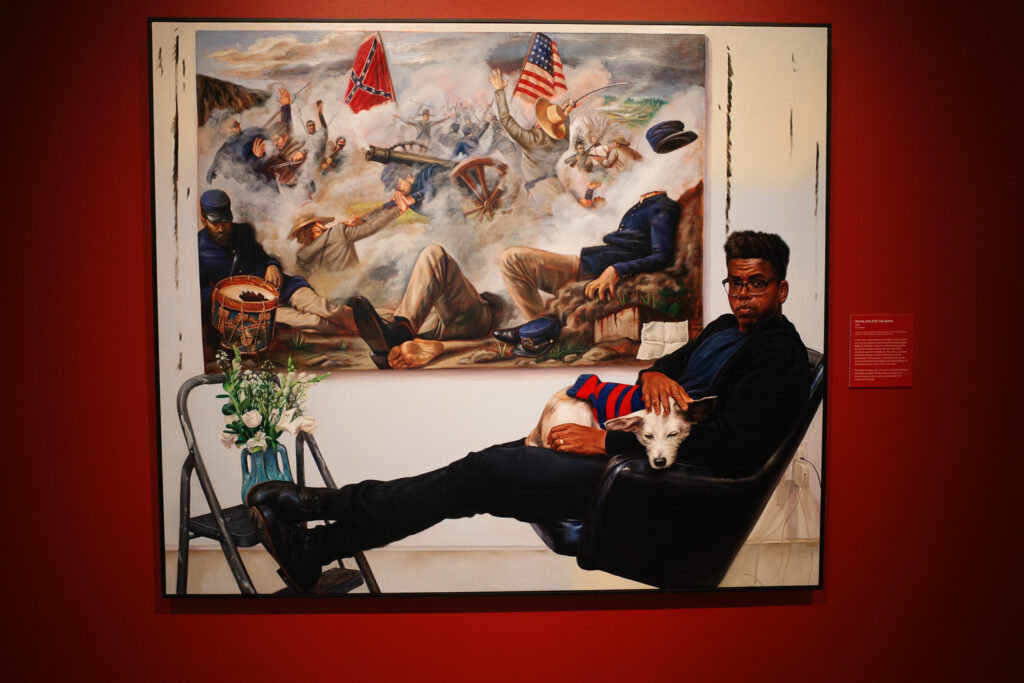 Mario Moore painting of african-american man painting a scene from the civil war.