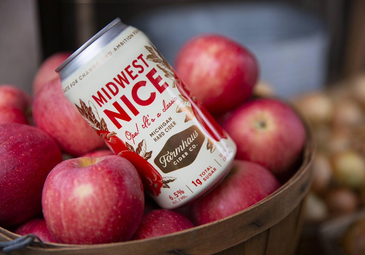 Farmhaus "midwest nice" cider in apple basket.