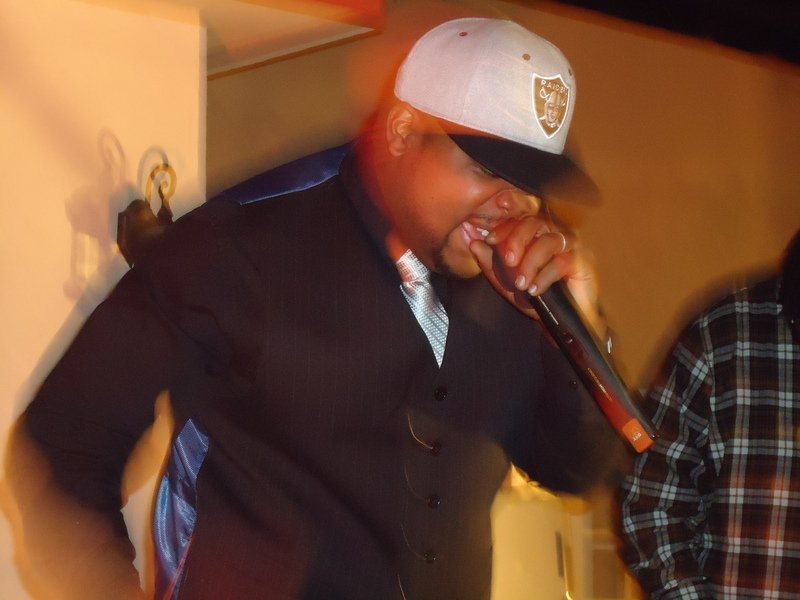 B face mahoney rapping into microphone.