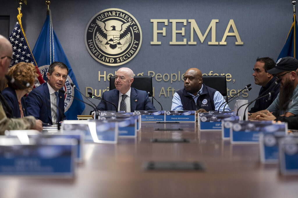 DHS Secretary Mayorkas visiting Fema HQ. Wall test says "FEMA"