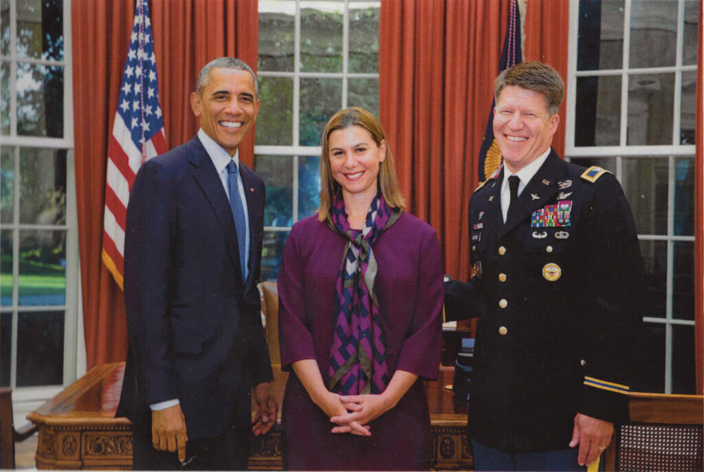 Slotkin as a CIA analyst with President Obama and an Army General in the Oval Office.