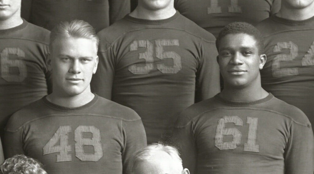 Gerald R. Ford and Willis War in Michigan football uniforms.