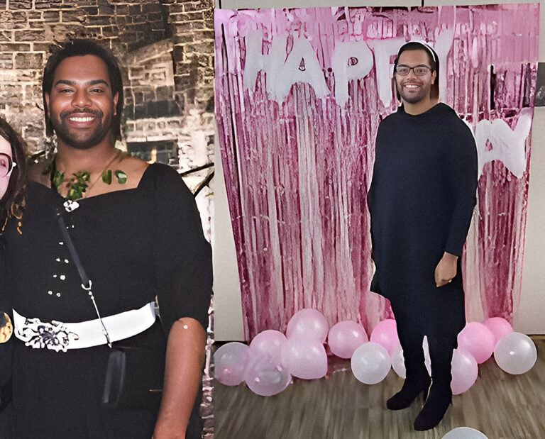 Man in black dress at birthday party.