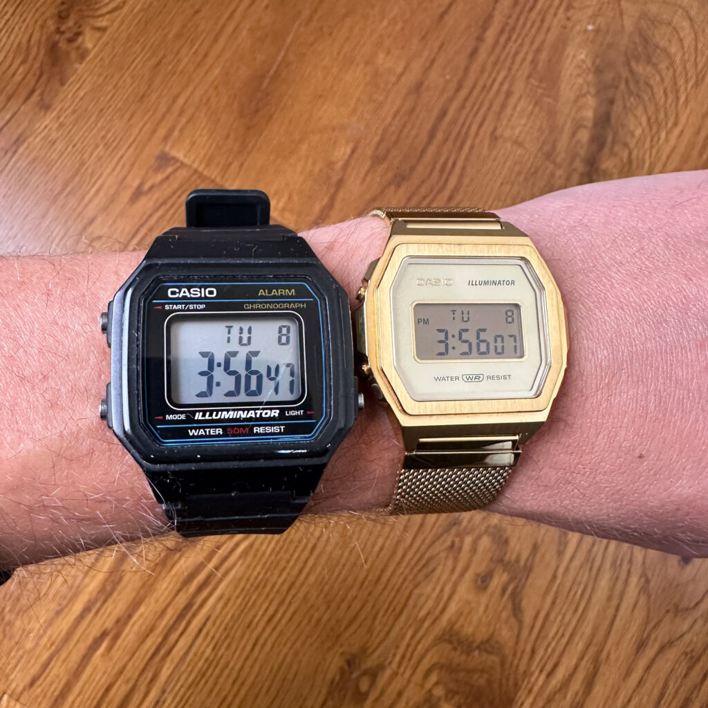 Black and gold casio watches on wrist.