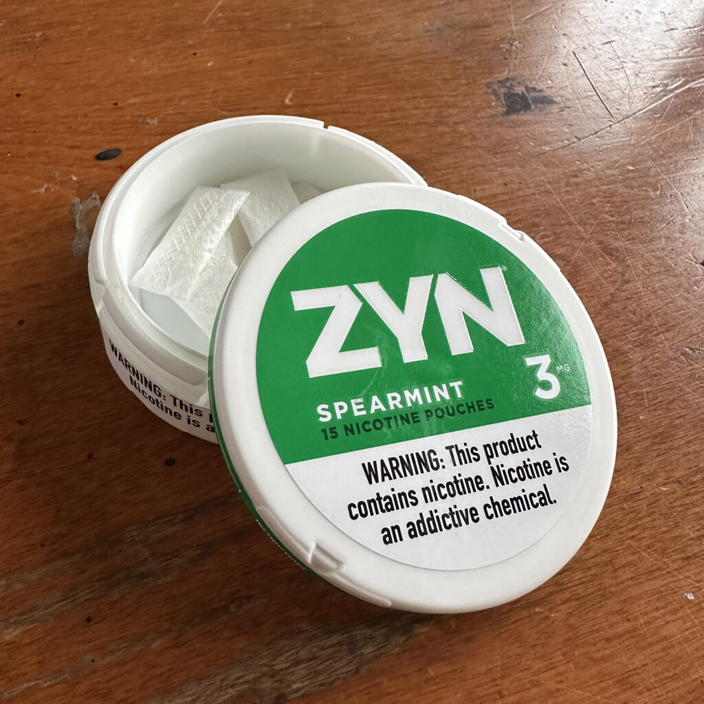 Zyn Spearmint 3mg container with text "Warning: This product contains nicotine. Nicotine is an addictive chemical."