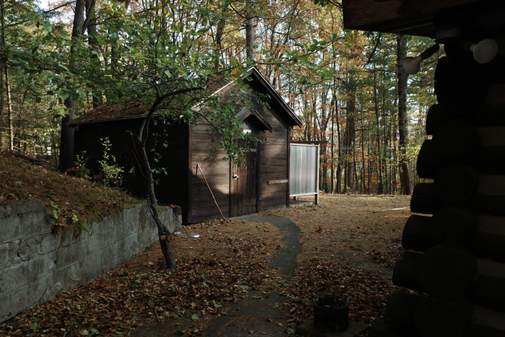 Small wooden building in woods