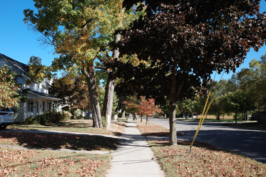 Small town sidewalk and street.