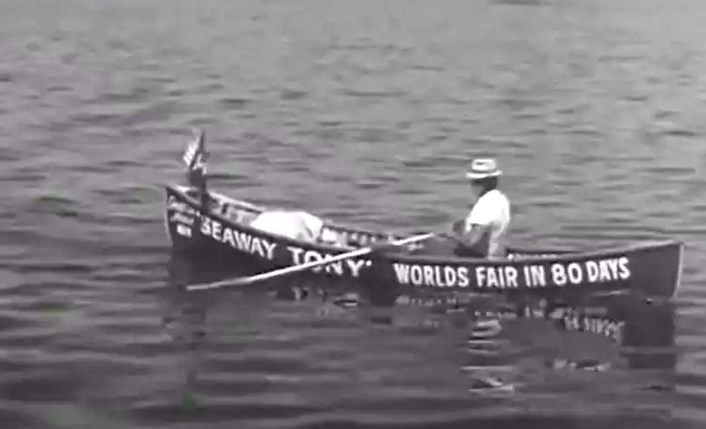 Tony in boat reading on side "Seaway Tony Worlds Fair in 80 Days"