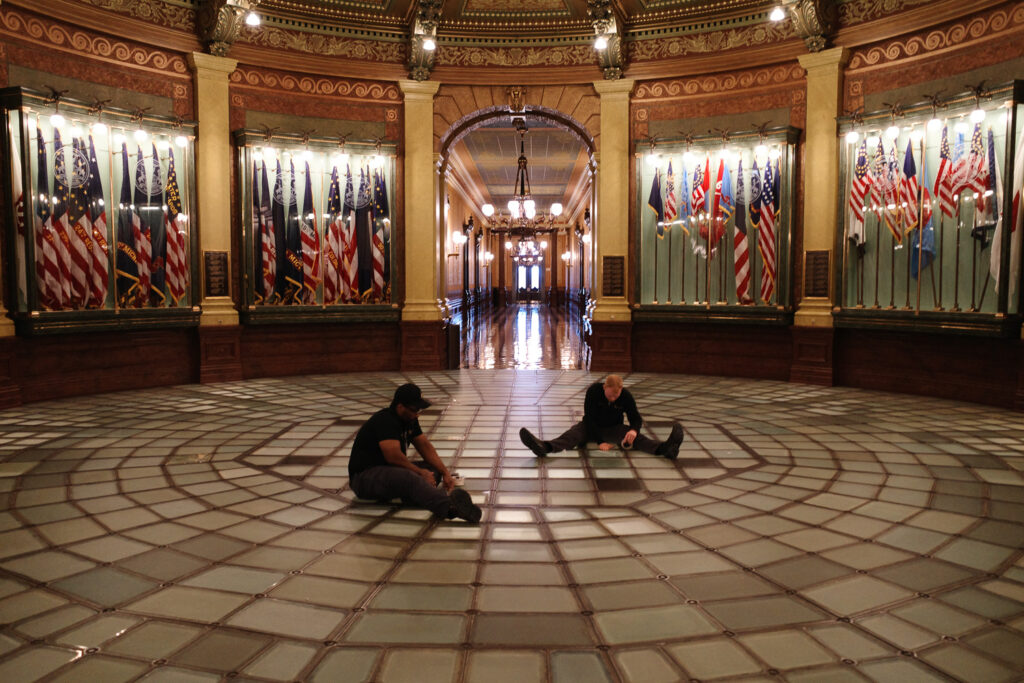 Workers taping floor of rotunda