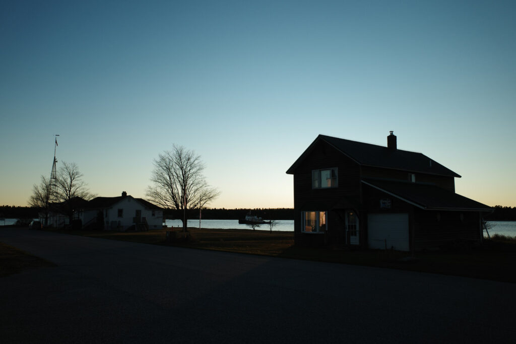 two lone houses on shoreline