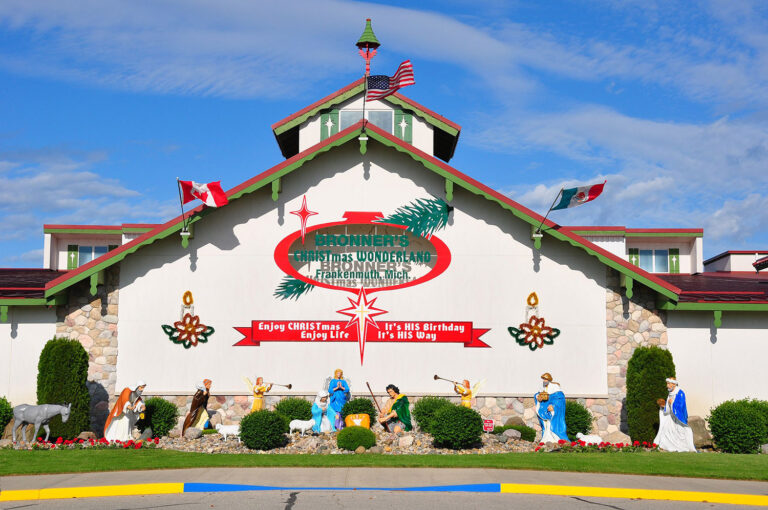 Exterior of Bronner's Christmas Wonderland with self titled sign and text reading "Enjoy Christmas Enjoy Life It's HIS birthday it's HIS way"