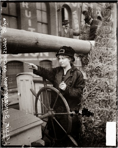 Girl at ship's wheel