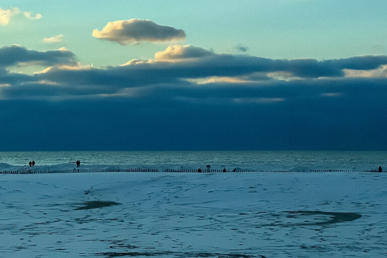 Snowy michigan beach landscape overlooking Lake Michigan