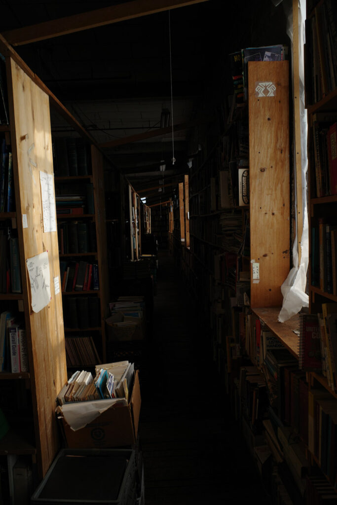 View down aisle in dark bookstore