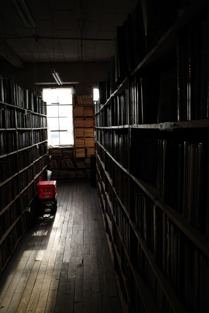 View down aisle in dark bookstore