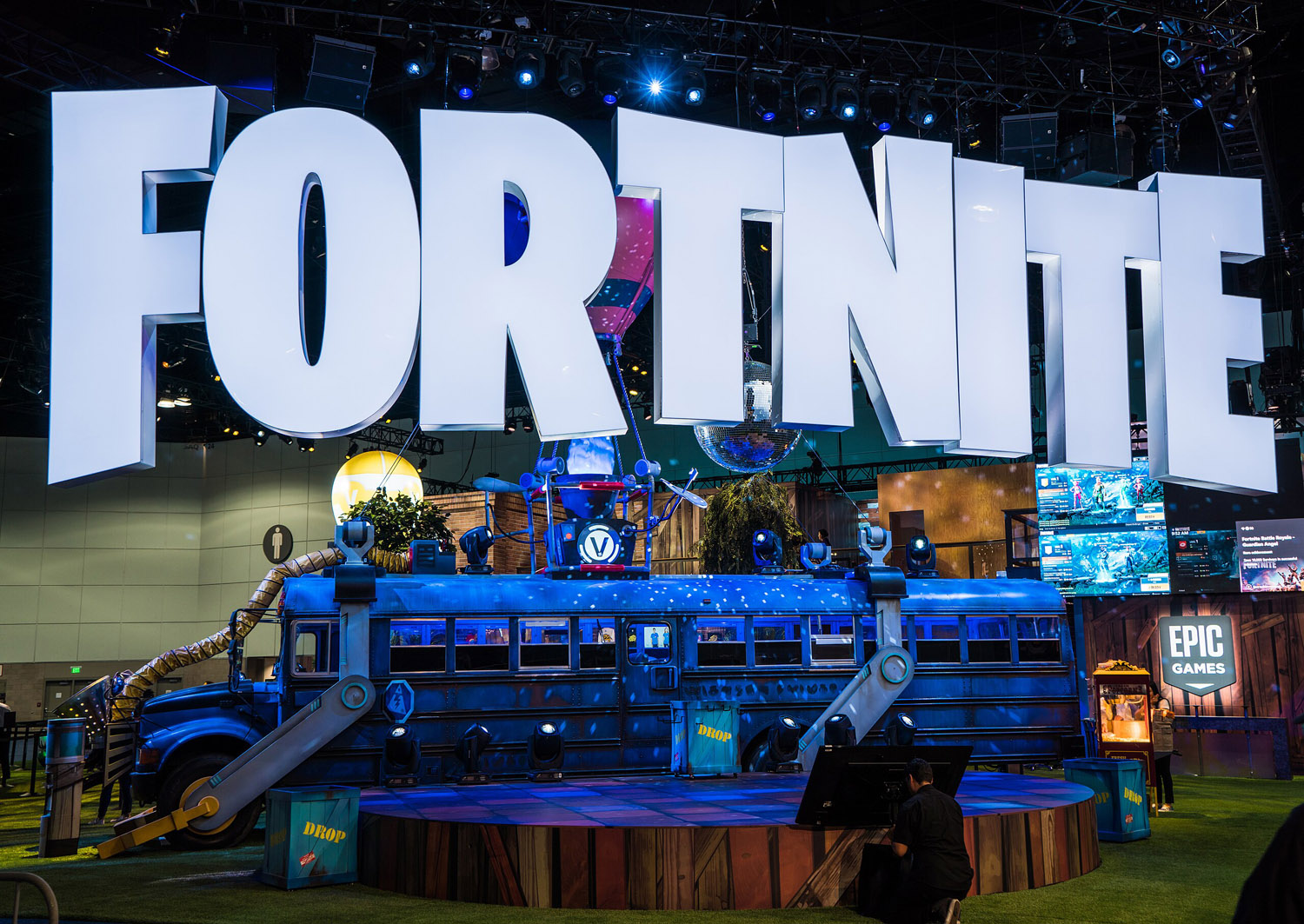 Fortnite sign with battle bus