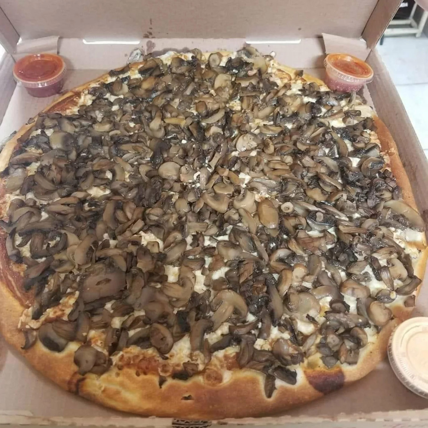 Pizza covered in mushrooms