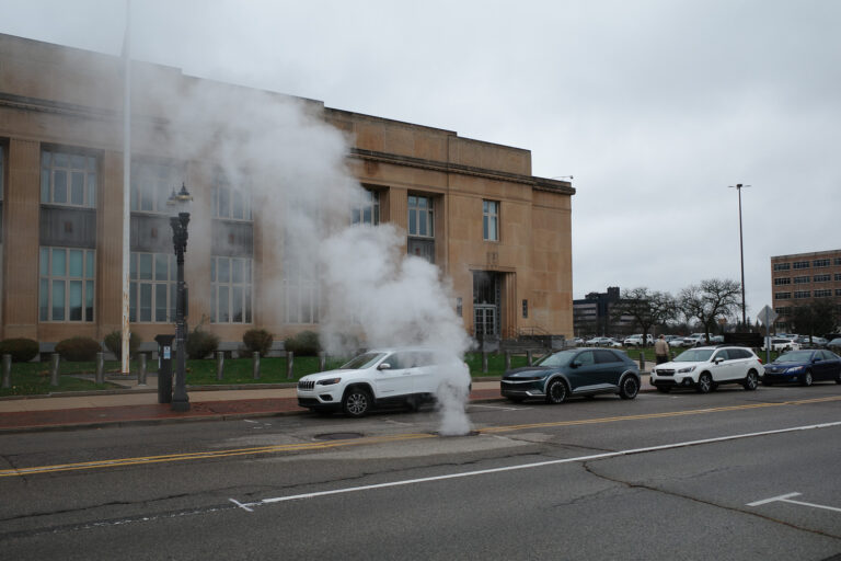 Steam vent on street in Lansing outside government building