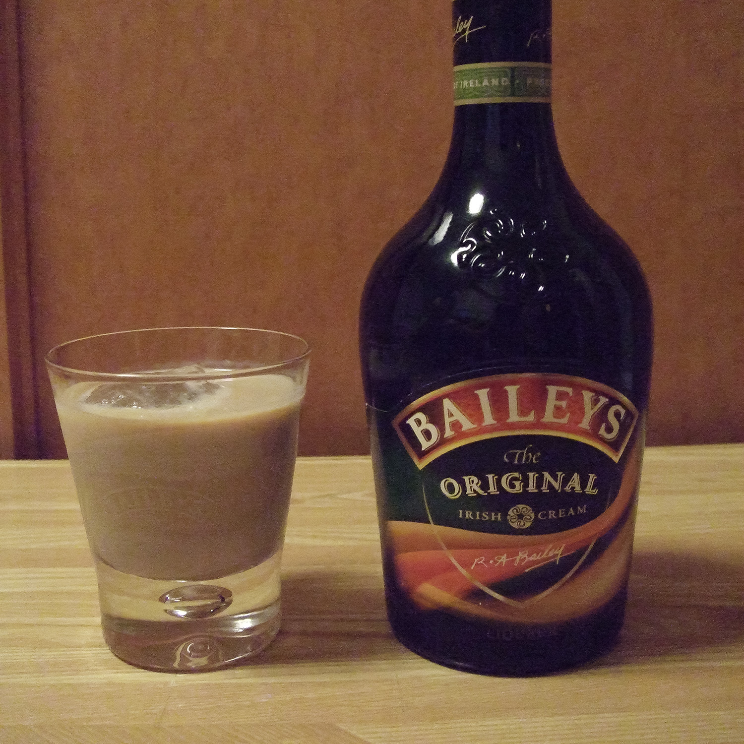 baileys bottle with glass of baileys