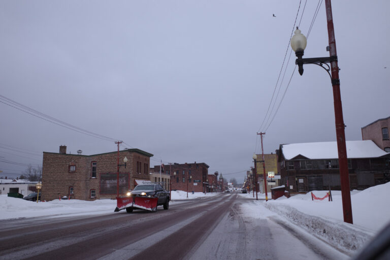 Snowplow driving in downtown Calumet