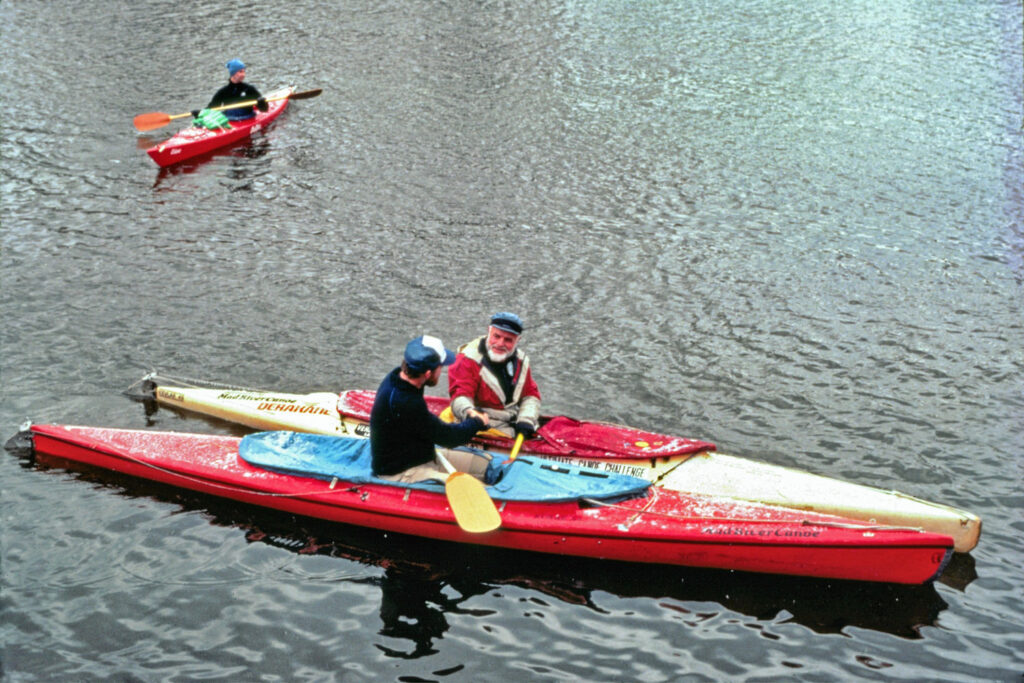 Verlen Kruger in canoe on lake.