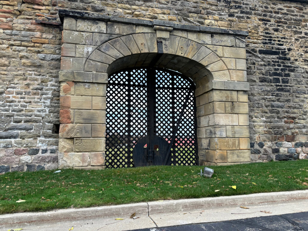 Metal gate in stone wall