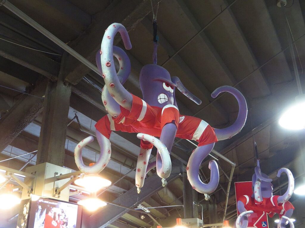 Stuffed octopus toy hanging on ceiling of arena