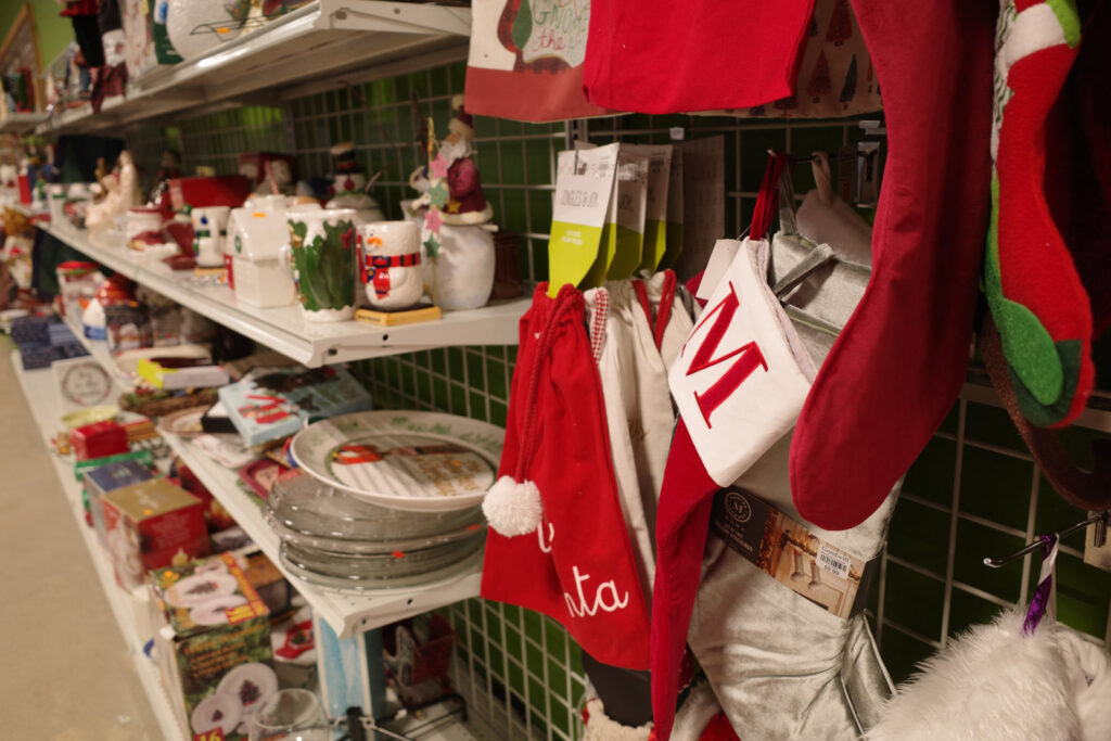 Holiday stockings and mugs on shelf