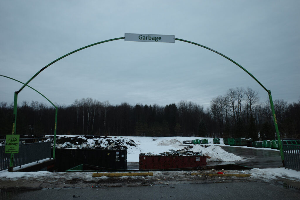 Sign saying "Garbage" at dump