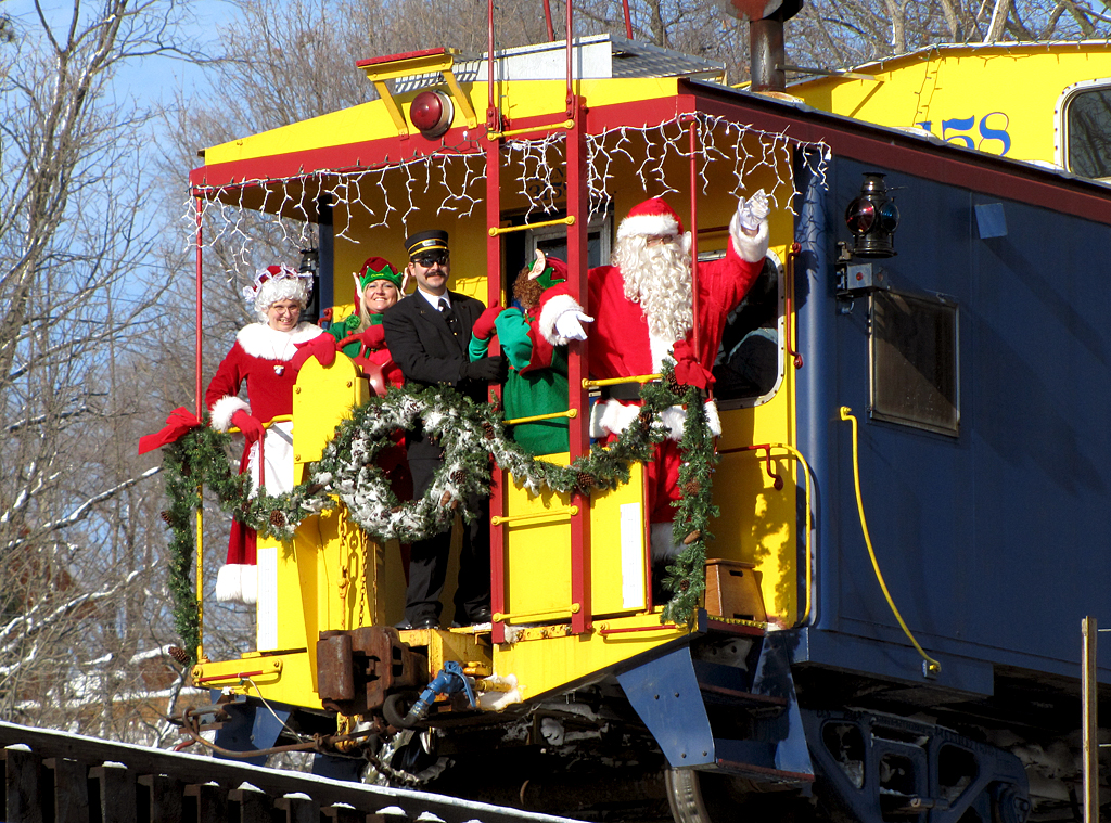 Santa and helpers on train