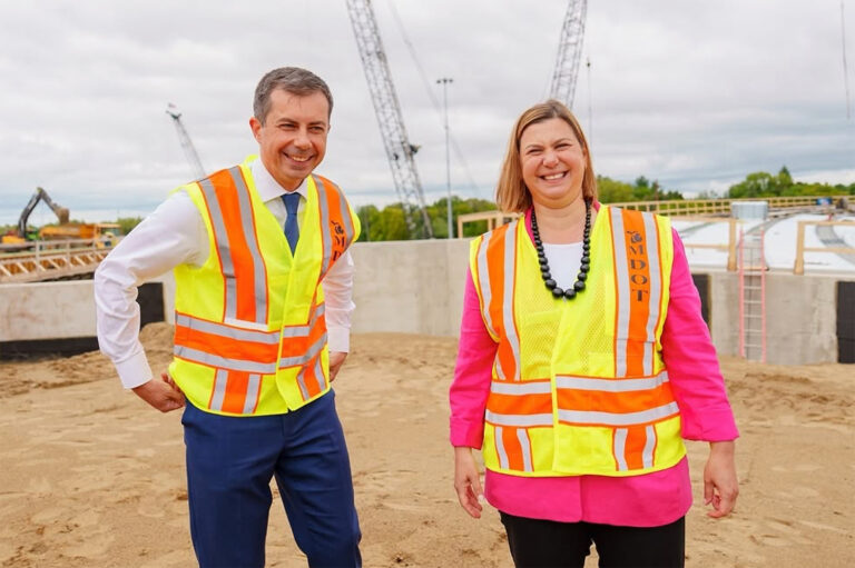 Pete Buttigieg and Alyssa Slotkin wearing construction vests